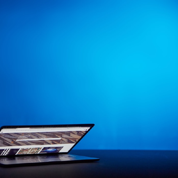 AI tweets about AI Laptop with blue background